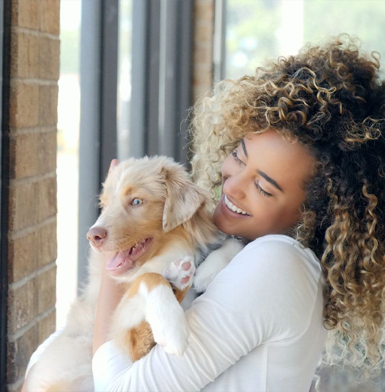 New Client Form and Resources: Woman Carrying Puppy